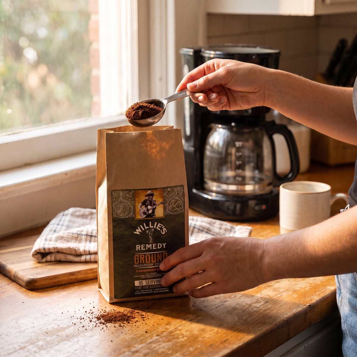 Scooping Willie's CBD Ground Mushroom Coffee into a coffee maker