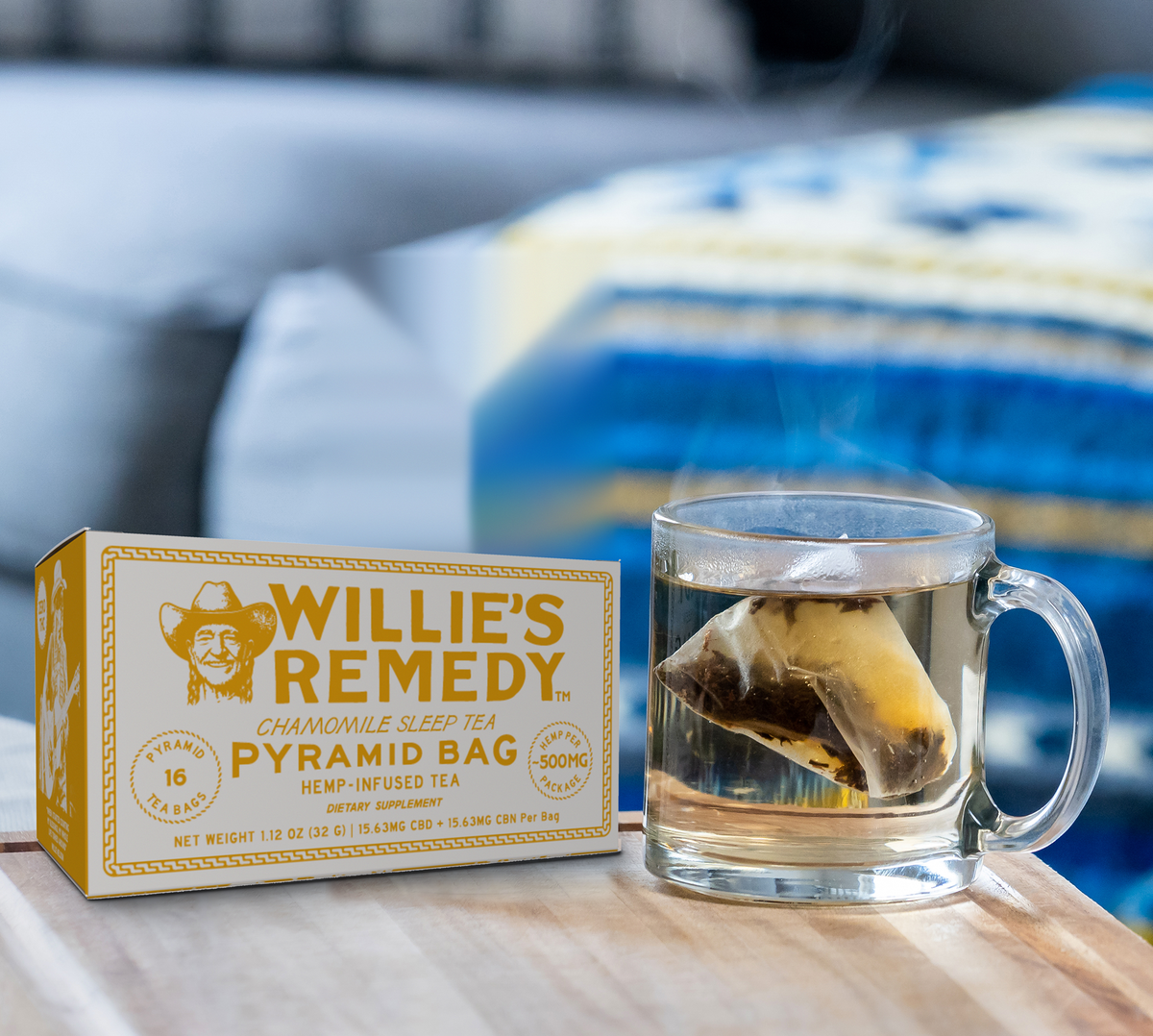 Cup of Willie's Remedy Chamomile hemp tea steeping next to the tea box